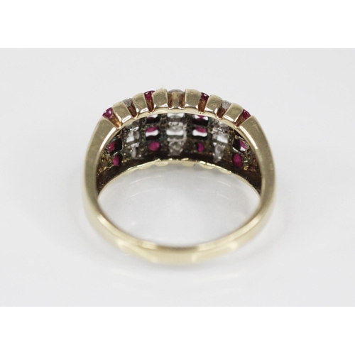 124 - A ruby and diamond 9ct gold bombe ring, the head designed as alternating rows of brilliant cut diamo... 