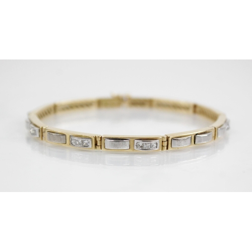 126 - A diamond set 18ct gold line bracelet, designed as ten yellow gold rectangular links set with altern... 