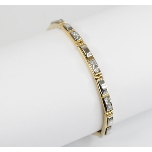 126 - A diamond set 18ct gold line bracelet, designed as ten yellow gold rectangular links set with altern... 