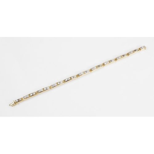 126 - A diamond set 18ct gold line bracelet, designed as ten yellow gold rectangular links set with altern... 