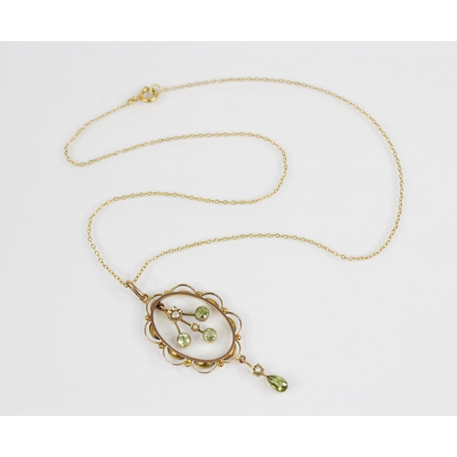 129 - An Edwardian peridot and pearl 9ct pendant, the principal three branch drop set with round mixed cut... 