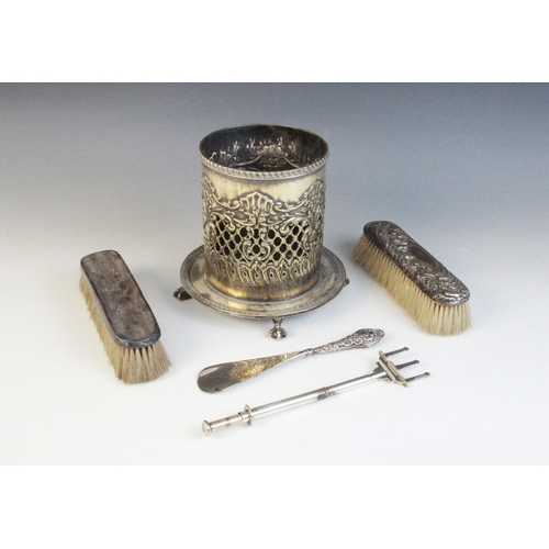 24 - A selection of silver and silver coloured wares, to include; an Edwardian silver heart-shaped pin di... 