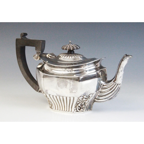41 - A late Victorian silver teapot, Chester 1899 (maker's mark worn), of inverted baluster faceted form,... 