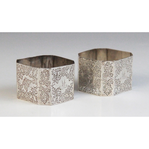 47 - A pair of Victorian silver napkin rings, Atkin Brothers, Sheffield 1897, each of square form with ca... 