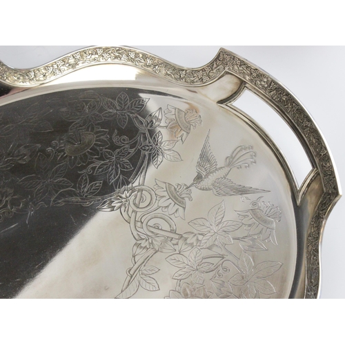 53 - An Aesthetic Movement silver plated tray by Silber & Fleming, of oval form, shaped border with cast ... 