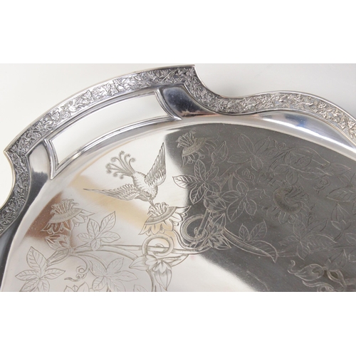 53 - An Aesthetic Movement silver plated tray by Silber & Fleming, of oval form, shaped border with cast ... 