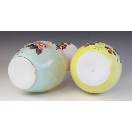 583 - A near pair of Victorian painted opaline glass vases, each of ovoid form with tapered necks, decorat... 