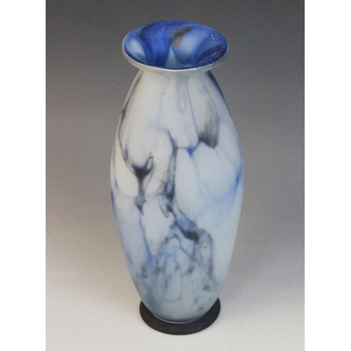 585 - An Art Nouveau blue marbled glass vase, late 19th century, of tapering ovoid form with flared rim an... 