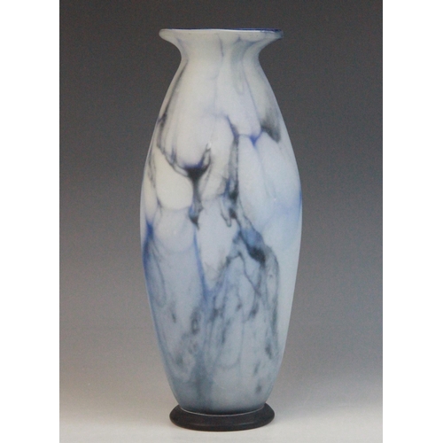 585 - An Art Nouveau blue marbled glass vase, late 19th century, of tapering ovoid form with flared rim an... 