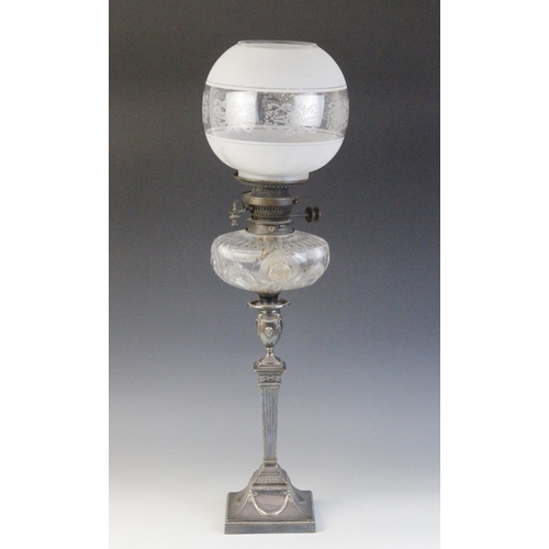 601 - An Edwardian Adams influence silver plated oil lamp, the associated etched glass shade above a cut g... 