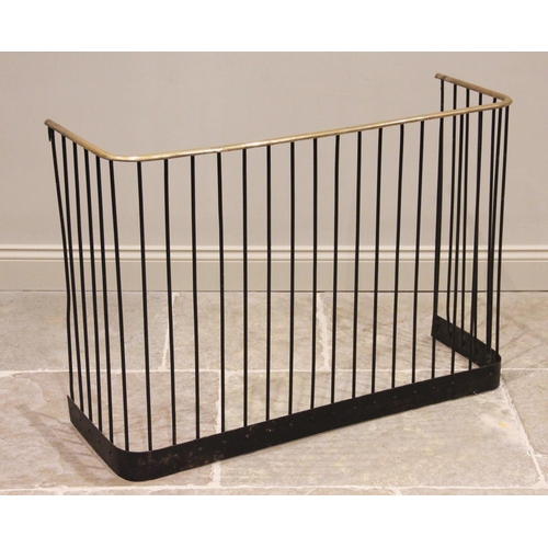 611 - A Victorian brass and iron fire guard/fender, of typical form, the brass top rail raised upon wrough... 