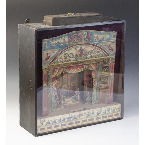 639 - A Victorian table top paper theatre, 19th century, with hand coloured proscenium arch, scenery and c... 