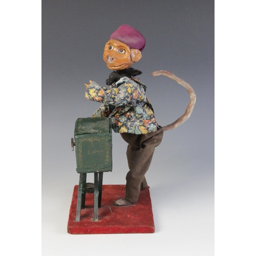 641 - A scratch built clockwork automaton modelled as a monkey winding an organ, the Papier Mache head wit... 