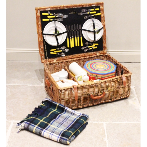 643 - A Fortnum and Masons wicker picnic hamper with contents, to include; a branded picnic blanket, 'Mela... 