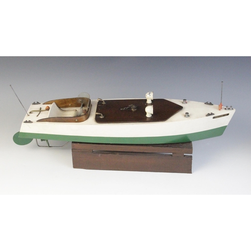 670 - A Tri-Ang clockwork speed boat, early 20th century circa 1930, the wooden hull painted in green and ... 