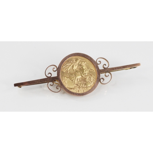 68 - A George V sovereign, dated 1912, set to a yellow metal bar brooch with scrolling surround, hinged p... 