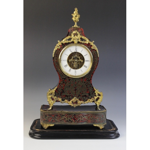 684 - A late 19th century French boule work and ebonised mantel timepiece, of waisted form with applied bo... 