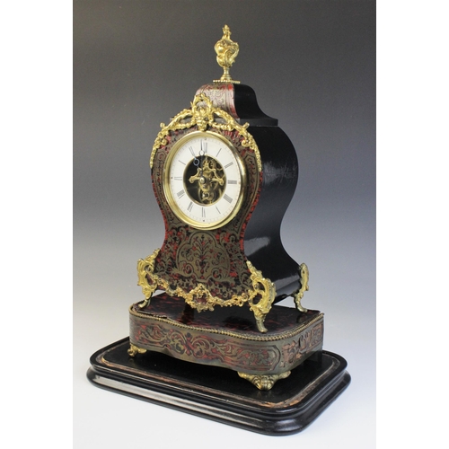 684 - A late 19th century French boule work and ebonised mantel timepiece, of waisted form with applied bo... 