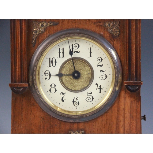 688 - A late 19th/early 20th walnut cased German musical bracket clock, the openwork pediment above an arc... 