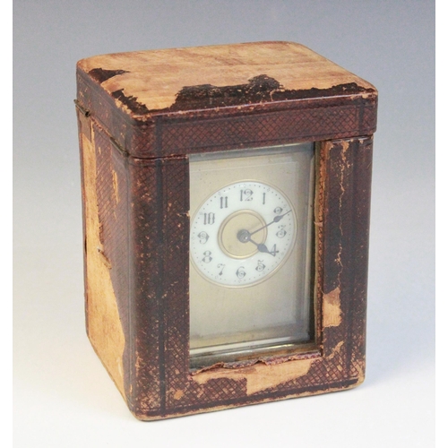 690 - An early 20th century brass cased carriage timepiece, the 5cm ivory coloured ceramic dial applied wi... 