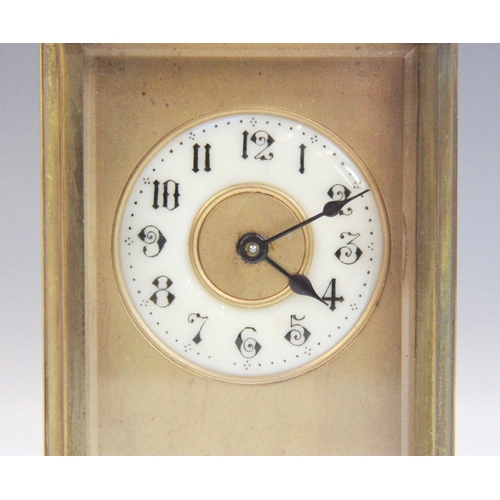 690 - An early 20th century brass cased carriage timepiece, the 5cm ivory coloured ceramic dial applied wi... 