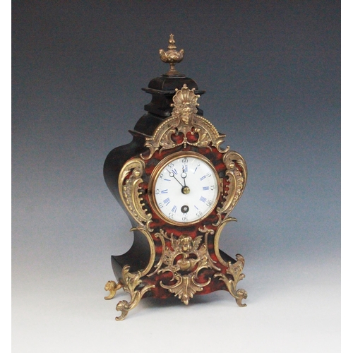 693 - A late 19th century Louis XVI style gilt metal mounted and simulated boule mantel timepiece, of typi... 