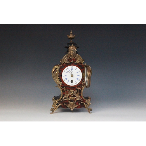 693 - A late 19th century Louis XVI style gilt metal mounted and simulated boule mantel timepiece, of typi... 