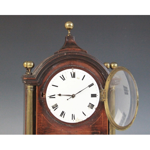 694 - A Regency style mahogany cased mantel timepiece, early 20th century, the arched case with spherical ... 