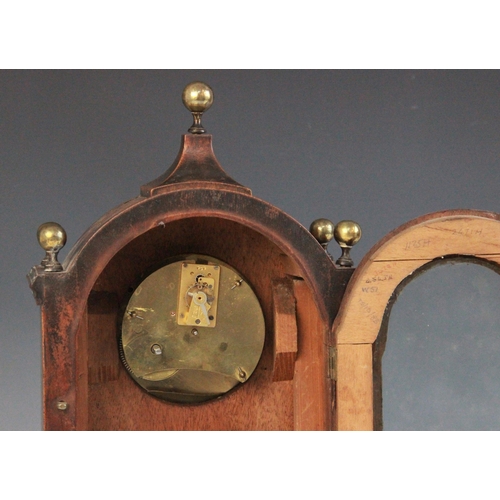 694 - A Regency style mahogany cased mantel timepiece, early 20th century, the arched case with spherical ... 