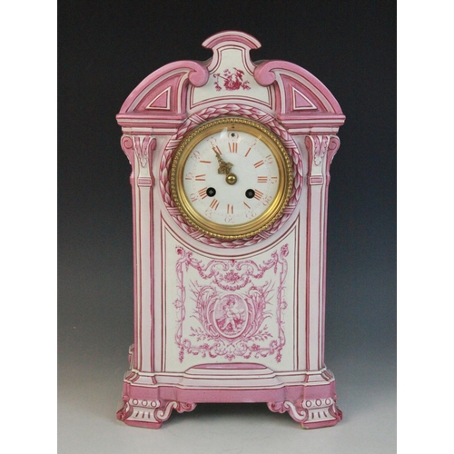 695 - A late 19th century Gien pottery mantel clock, the architectural case highlighted with pink and red ... 