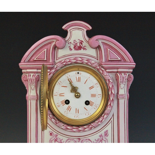 695 - A late 19th century Gien pottery mantel clock, the architectural case highlighted with pink and red ... 