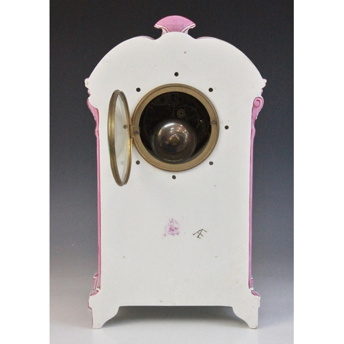 695 - A late 19th century Gien pottery mantel clock, the architectural case highlighted with pink and red ... 