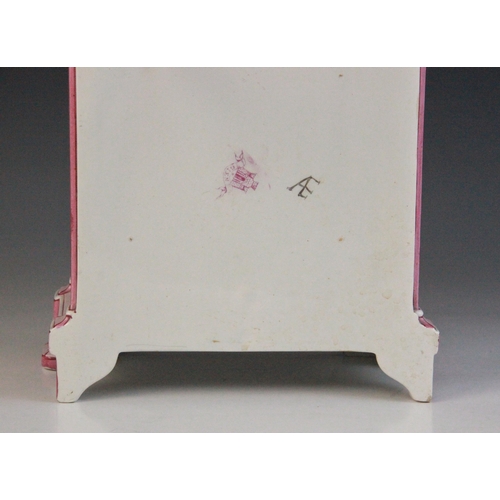 695 - A late 19th century Gien pottery mantel clock, the architectural case highlighted with pink and red ... 