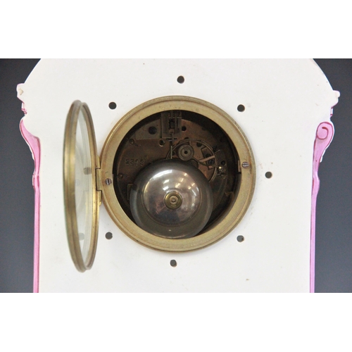 695 - A late 19th century Gien pottery mantel clock, the architectural case highlighted with pink and red ... 