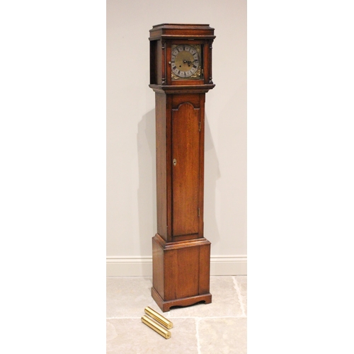 700 - An early 20th century oak cased grandmother clock, the caddy top with freestanding ring turned pilla... 