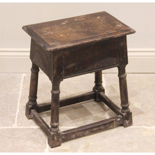 701 - An 18th century style oak joint stool, late 19th century, the rectangular moulded top raised upon ri... 