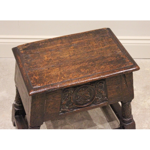 701 - An 18th century style oak joint stool, late 19th century, the rectangular moulded top raised upon ri... 