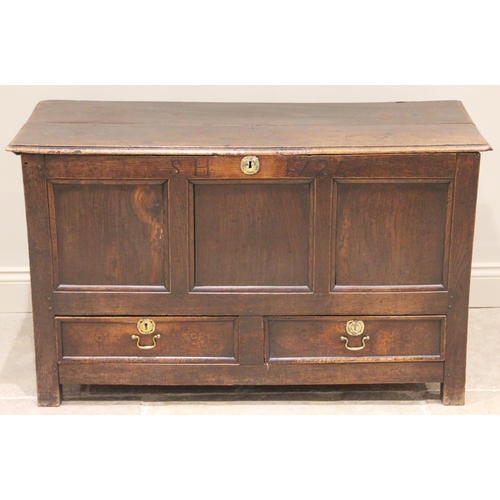 707 - An early 18th century oak mule chest, the rectangular moulded twin plank top above a frieze inlaid w... 