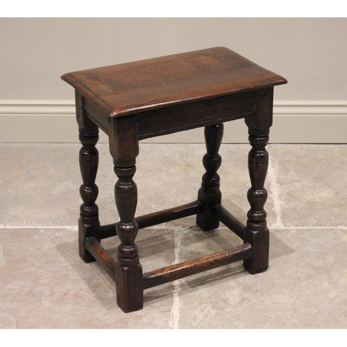 715 - A 17th century and later oak joint stool, the rectangular moulded top raised upon baluster turned an... 