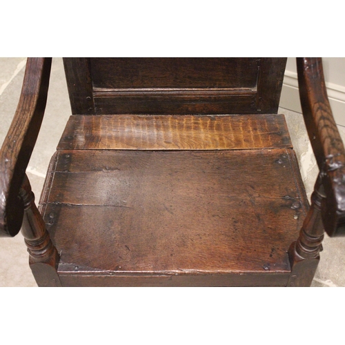 716 - A 17th century and later oak wainscot chair, the shaped pediment above two inverted panels extending... 