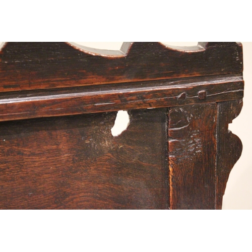 716 - A 17th century and later oak wainscot chair, the shaped pediment above two inverted panels extending... 