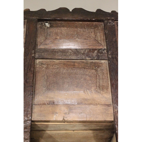 716 - A 17th century and later oak wainscot chair, the shaped pediment above two inverted panels extending... 