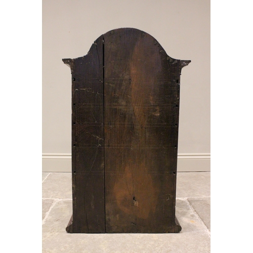 719 - An 18th century oak and mahogany cross banded spice cupboard, the break arch pediment terminating wi... 