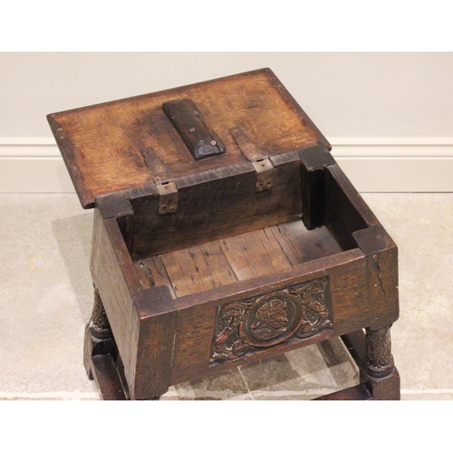 720 - A 17th century and later hinged oak joint stool, the rectangular moulded hinged top above a front pa... 