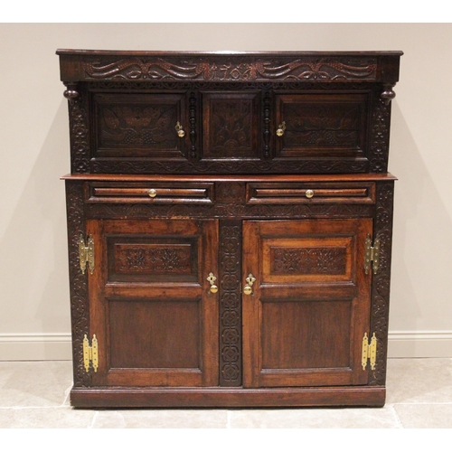 721 - An early 18th century and later constructed Welsh oak court cupboard, Cwpwrdd Deuddarn, dated 1706, ... 