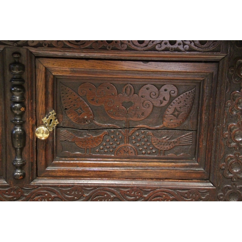 721 - An early 18th century and later constructed Welsh oak court cupboard, Cwpwrdd Deuddarn, dated 1706, ... 