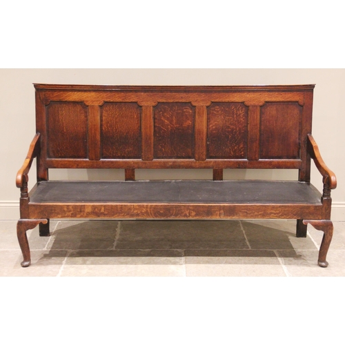 724 - A George III oak five panel settle, the moulded back rail above five invert moulded panels and a lat... 