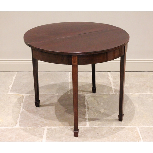 736 - A George III demi-lune mahogany folding tea table, the top with a channelled edge opening to a polis... 