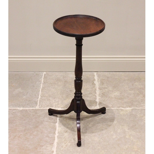 740 - An early 19th century mahogany tripod table or candle stand, the circular top with a raised moulded ... 