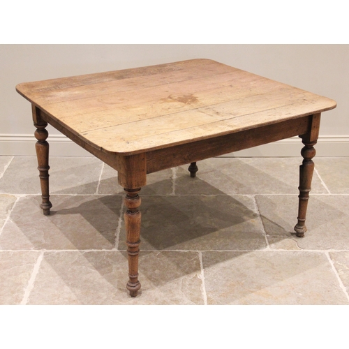 761 - A 19th century oak kitchen table, possibly French, the rectangular plank top with rounded corners ra... 